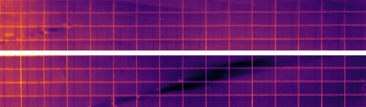 Thermal orthomosaic of solar module rows captured on a March evening. The module surfaces are purple to black and cold, only the grid of module joints is bright, and no hot spots are visible